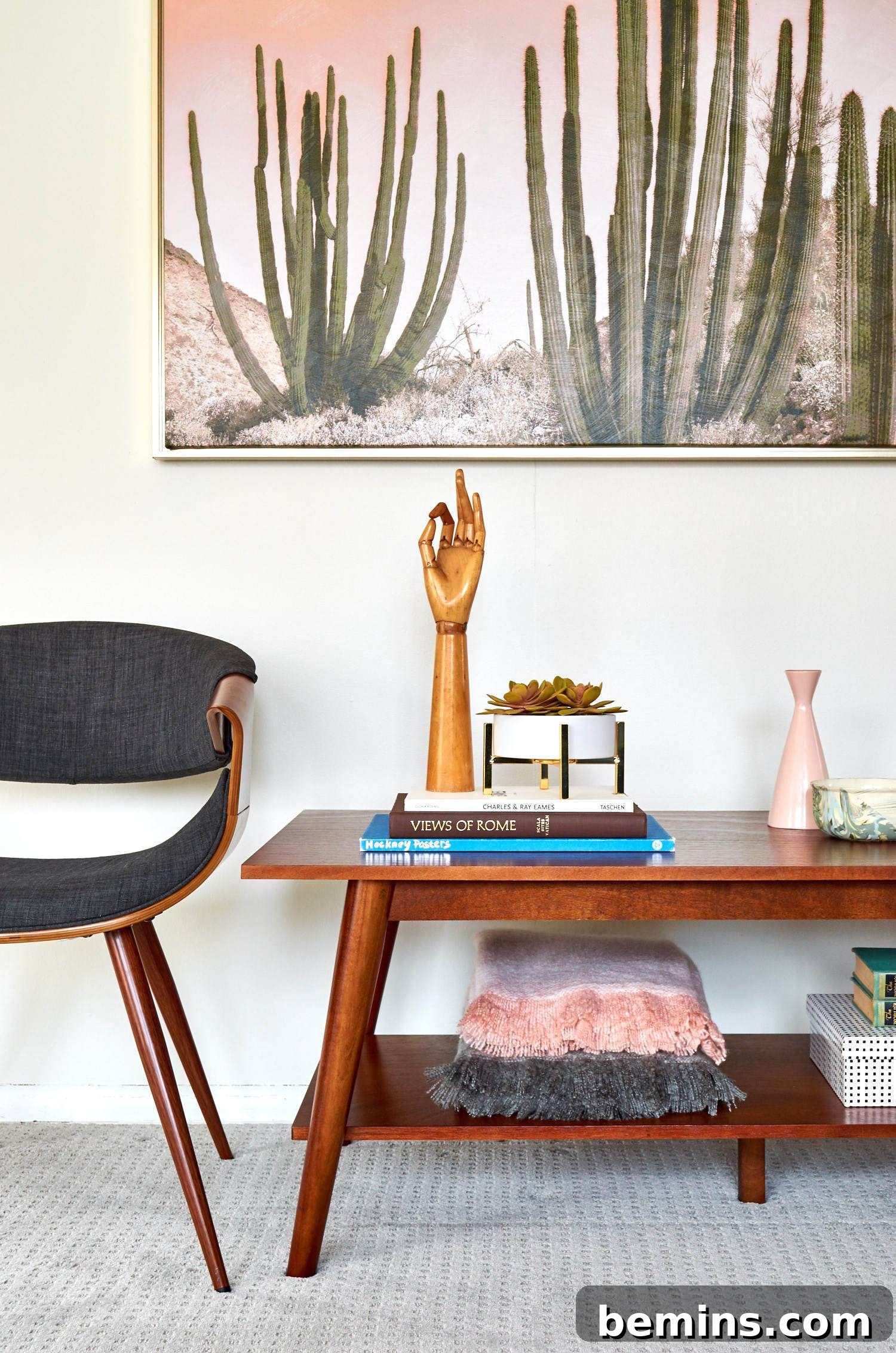 A painting sitting above a small wooden table.