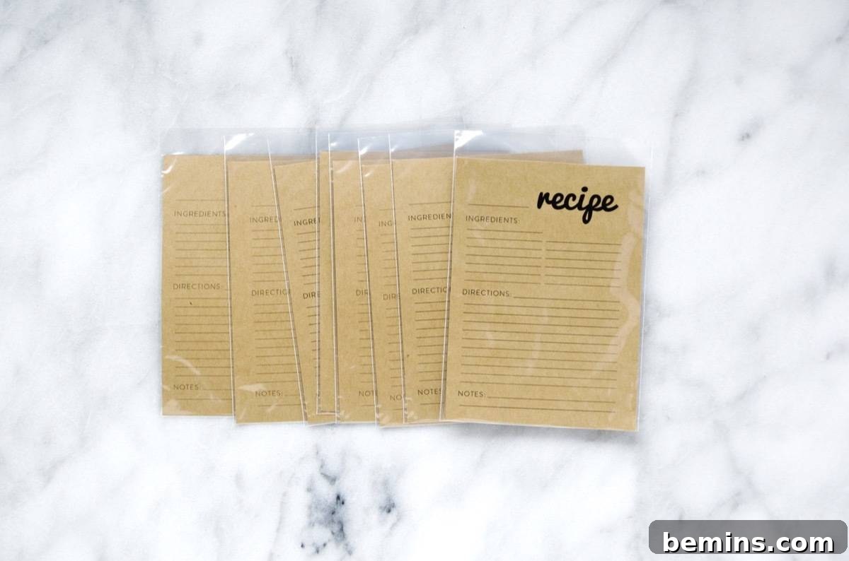 Craft a Personalized Recipe Organizer 5 Placing free printable recipe cards into protective vinyl sleeves
