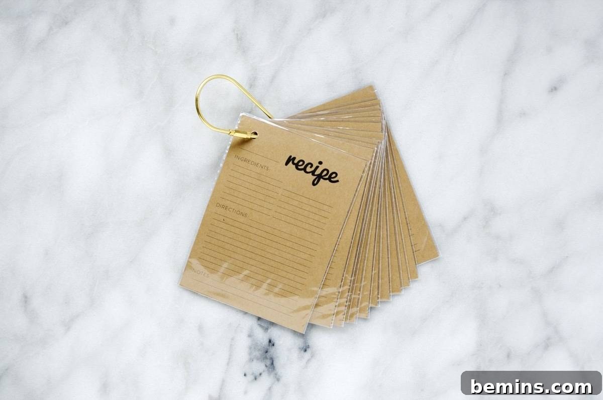 Craft a Personalized Recipe Organizer 7 Assembling a key ring recipe holder with free printable cards and protective sleeves