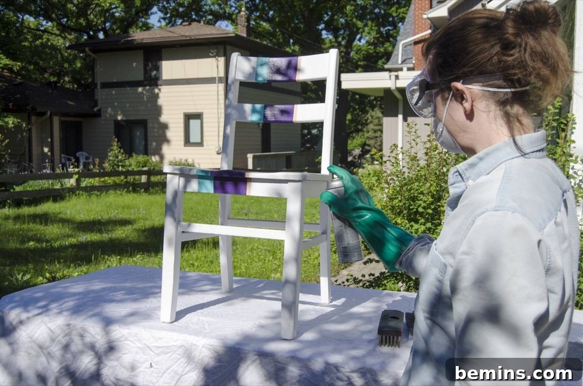 Applying paint stripper to wood furniture