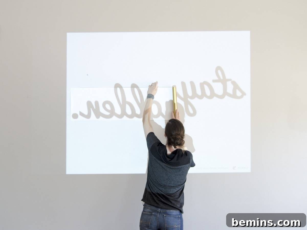 Projecting the design onto the wall for tracing