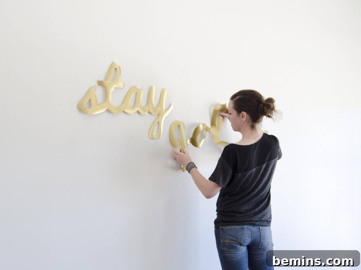 Positioning the vinyl decal on the wall