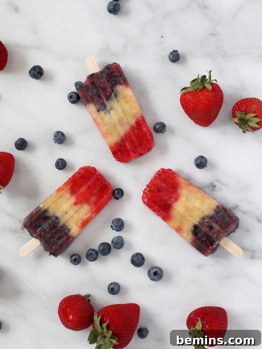 Patriotic Pops: Festive Frozen Treats for Everyone 7 Champagne popsicles with fresh berries on a surface