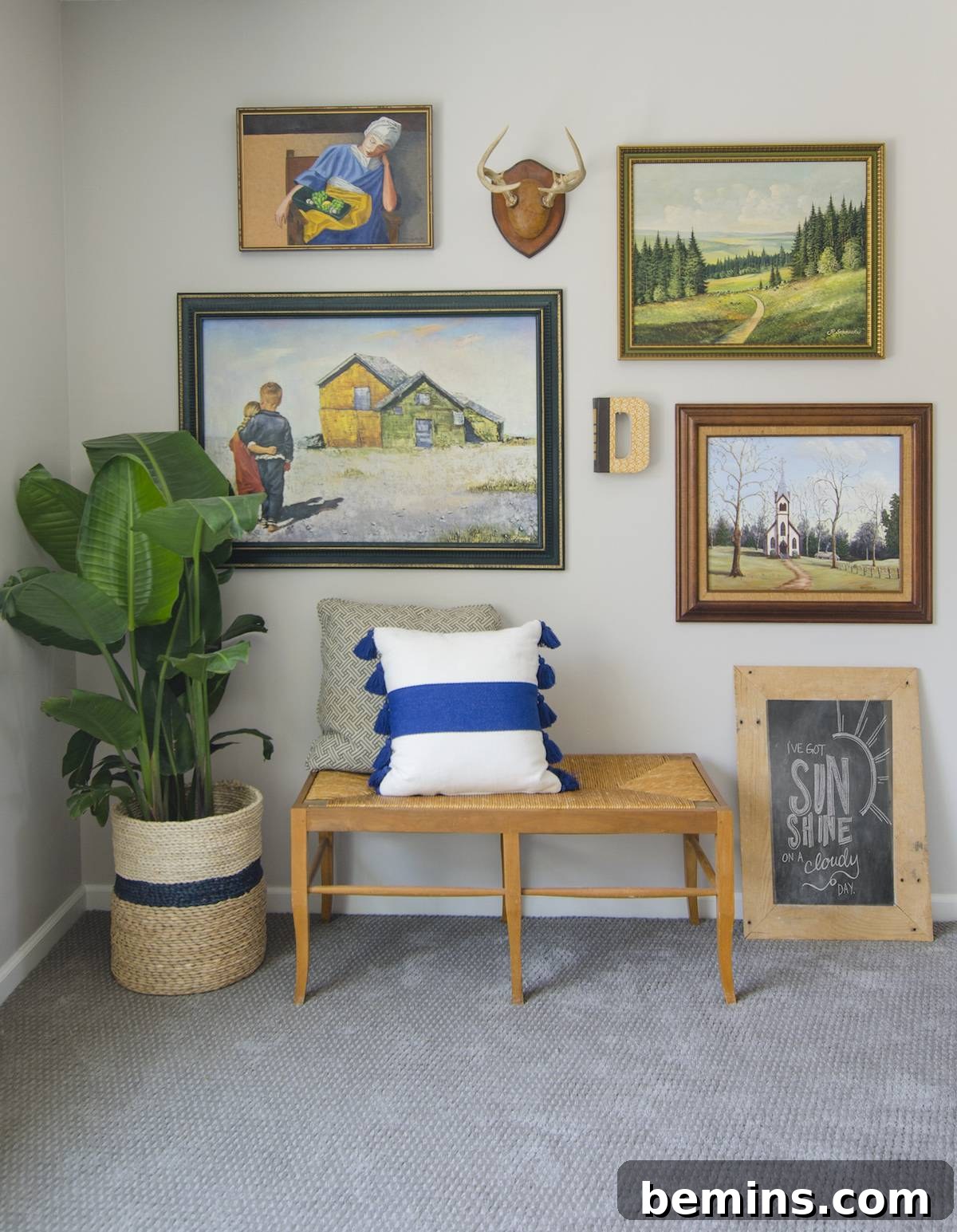 Filling in gaps in the gallery wall with furniture and plants.