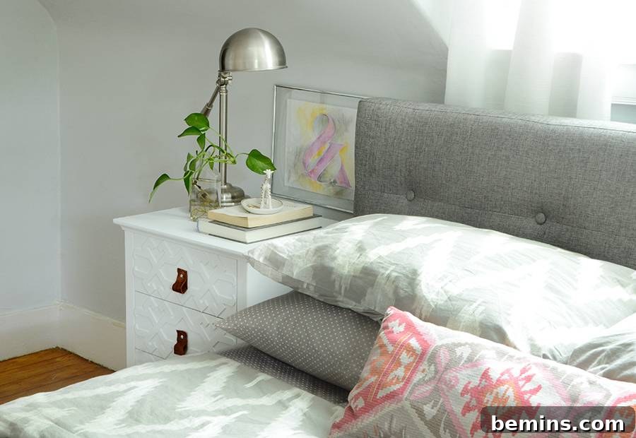Finished nightstand makeover with white chalk paint and leather pulls
