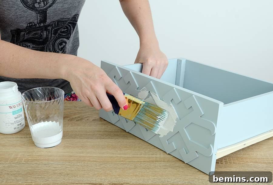 Wiping down the nightstand with a damp paper towel