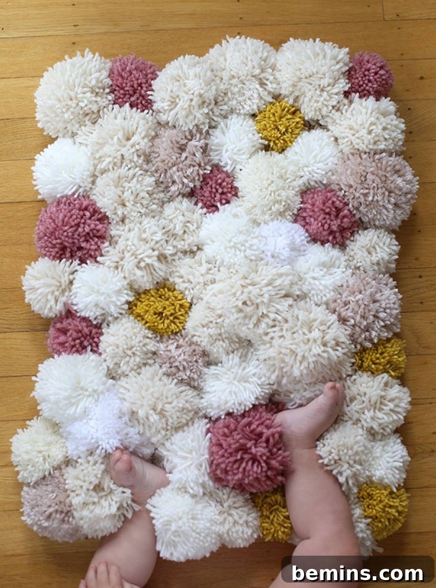 75 DIY Decor Projects to Delight Your Kids 43 Pom Pom Rug
