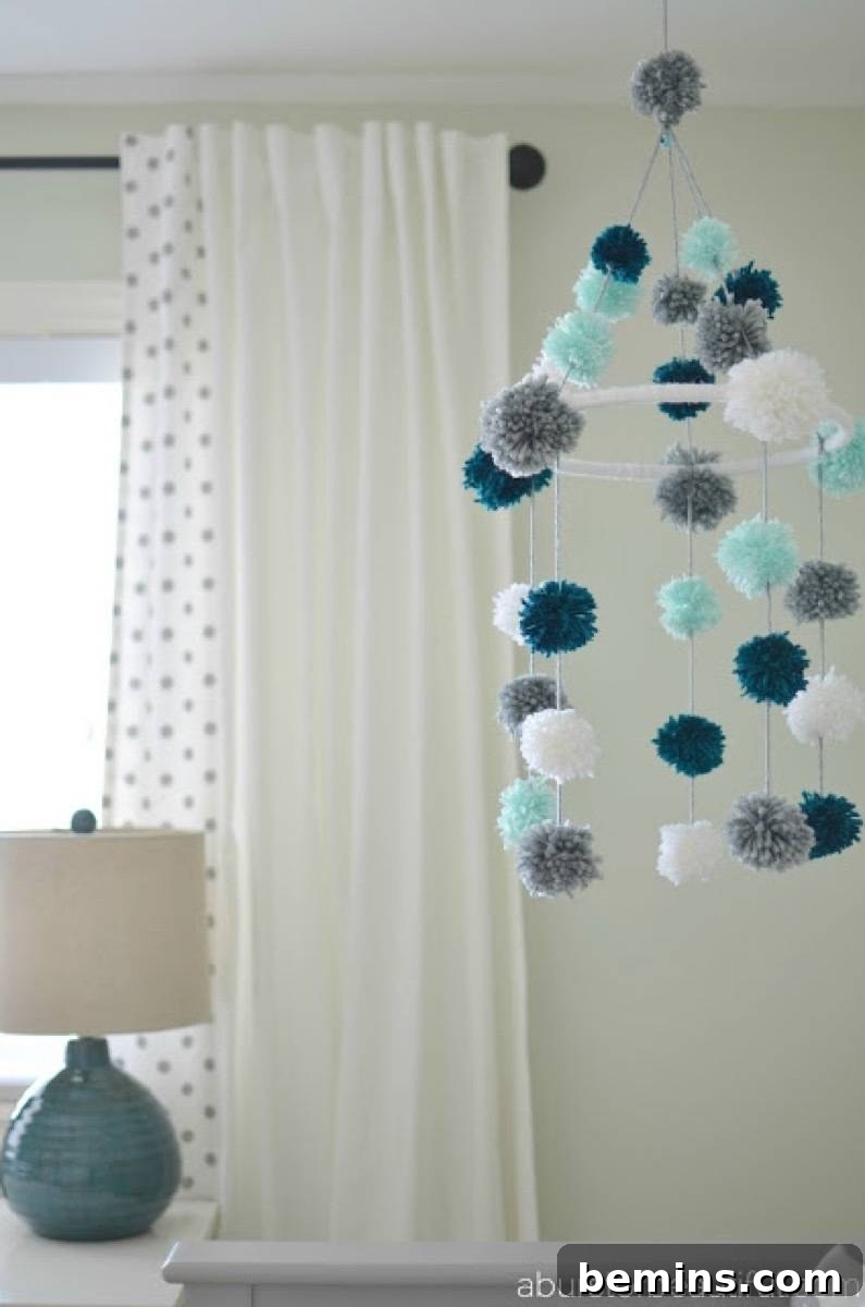 75 DIY Decor Projects to Delight Your Kids 55 Pom-pom mobile