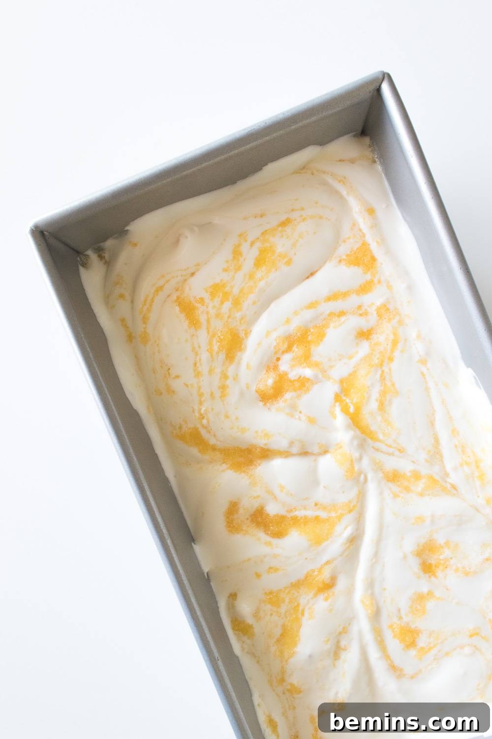Machine-Free Peach Ice Cream Delight 7 Swirling Peach Puree into Ice Cream