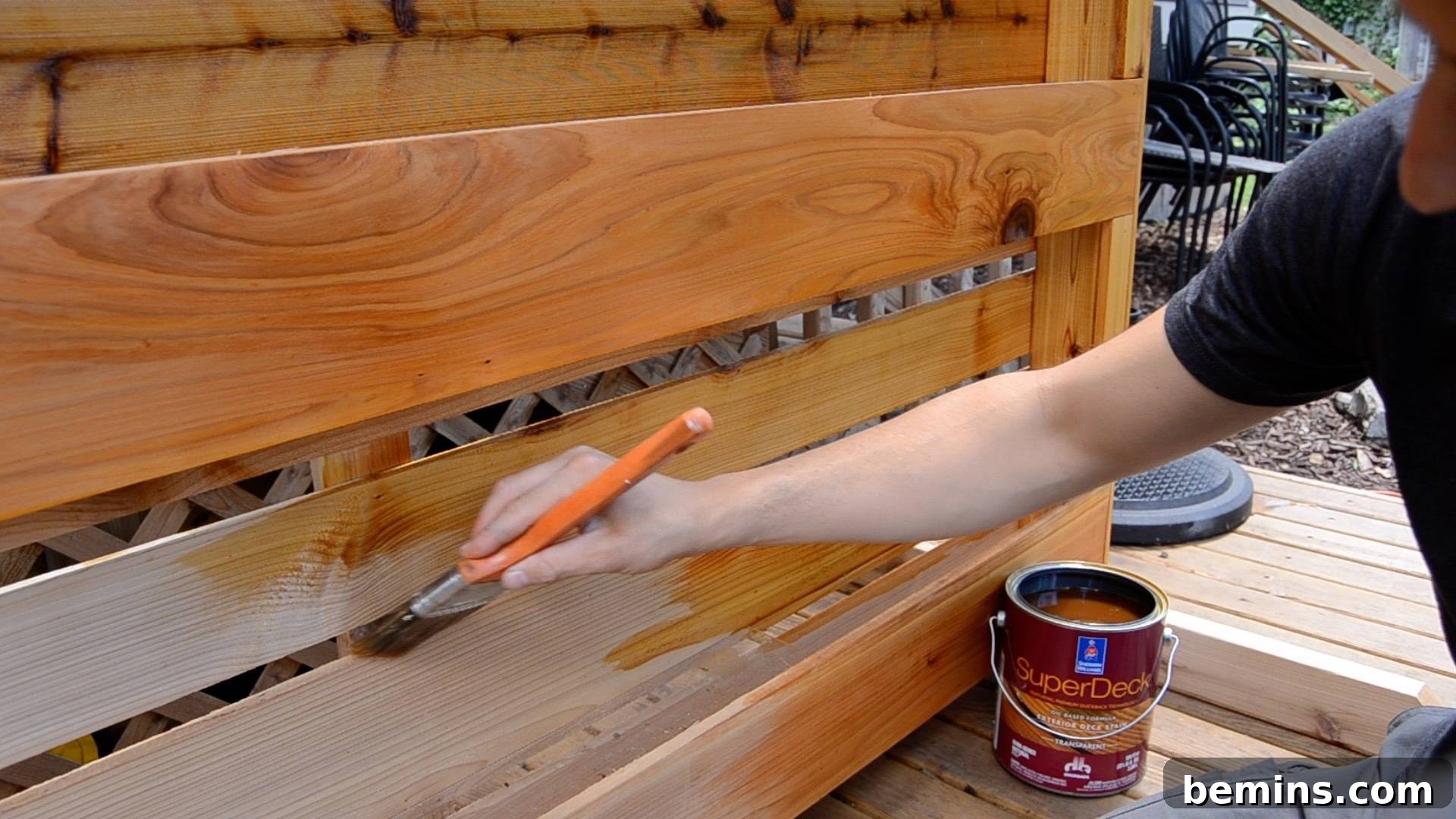 Varnishing a wooden gate