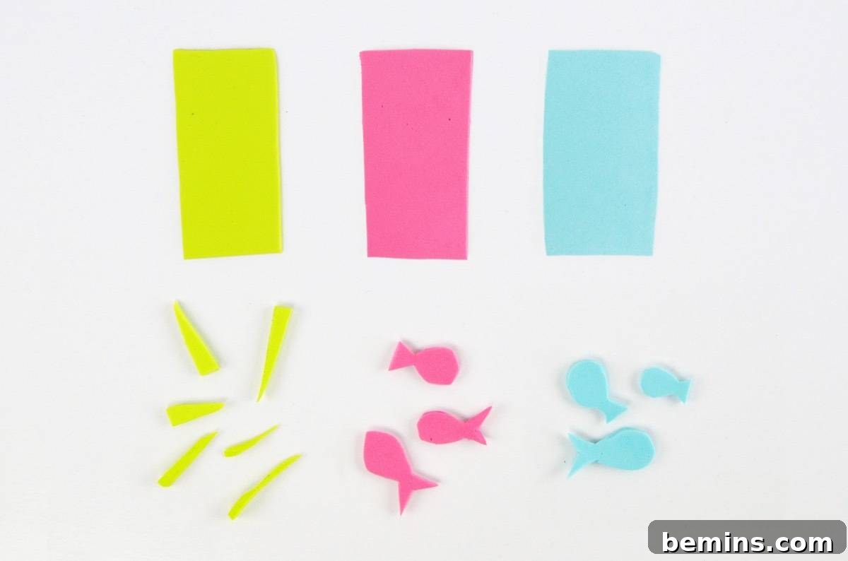 Cutting foam into fish and grass shapes for the mini fish tank