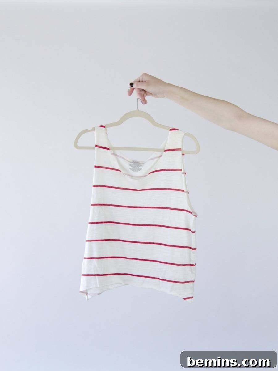 Three Creative T-Shirt Transformations 10 T-Shirt DIY Idea: How to transform a regular t-shirt into a scoop neck shirt with just scissors