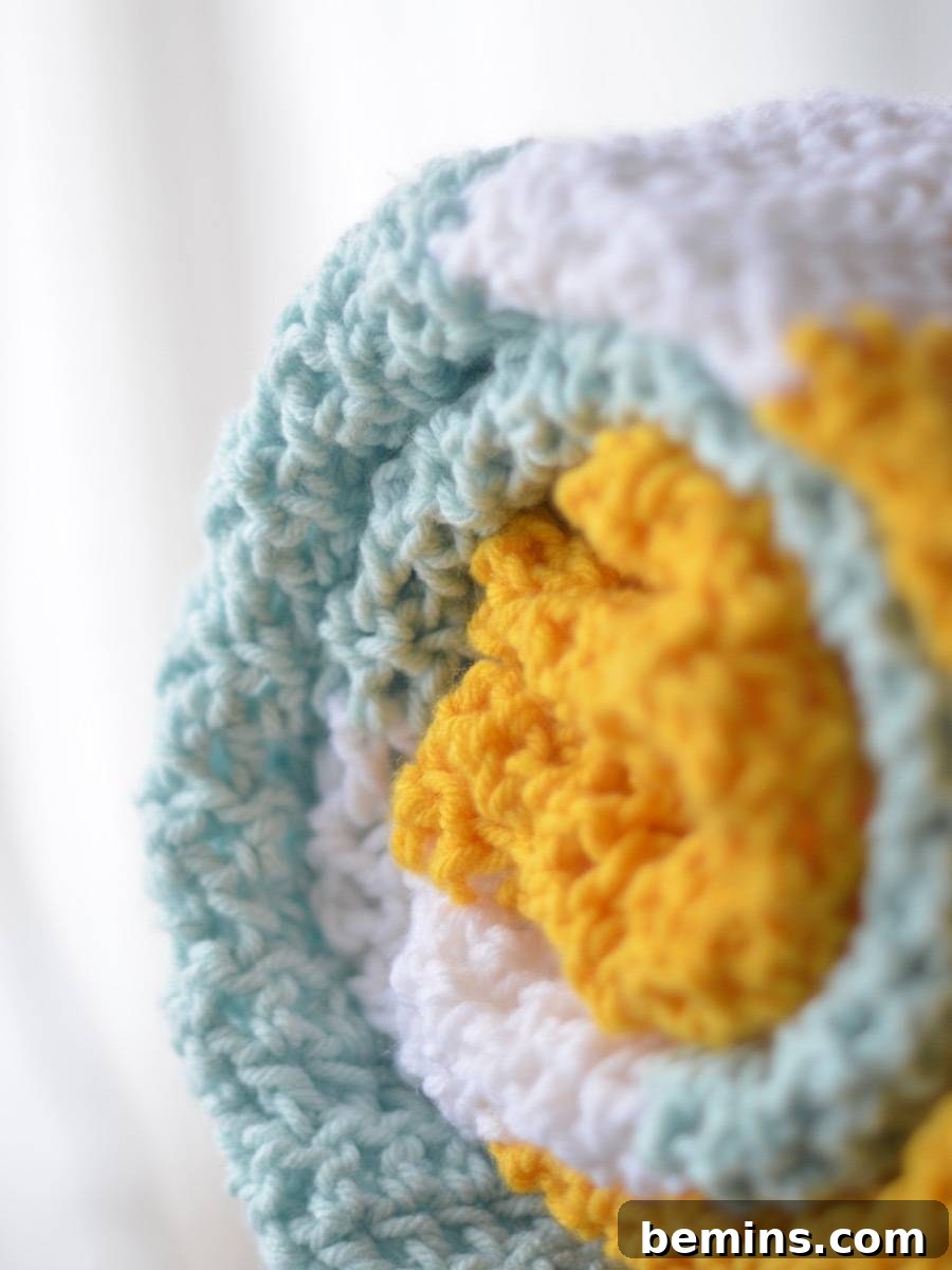 Gender-neutral crochet baby blanket in progress