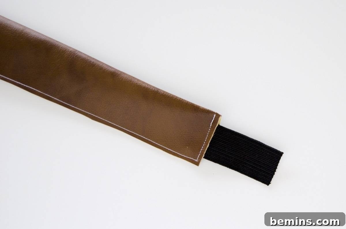 Adding elastic to the vinyl strap for the picnic blanket