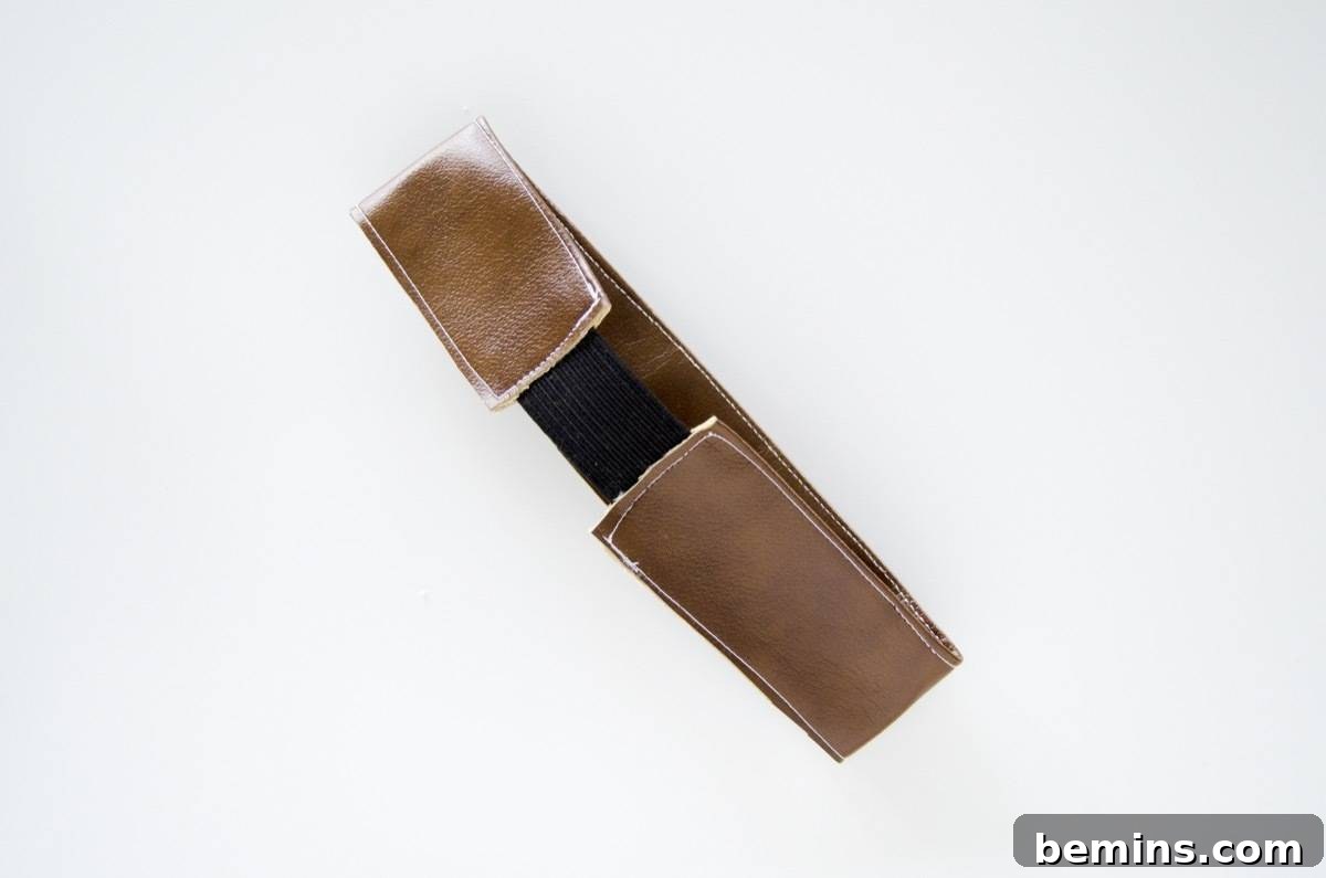 Stitching the elastic to the vinyl strap for secure closure
