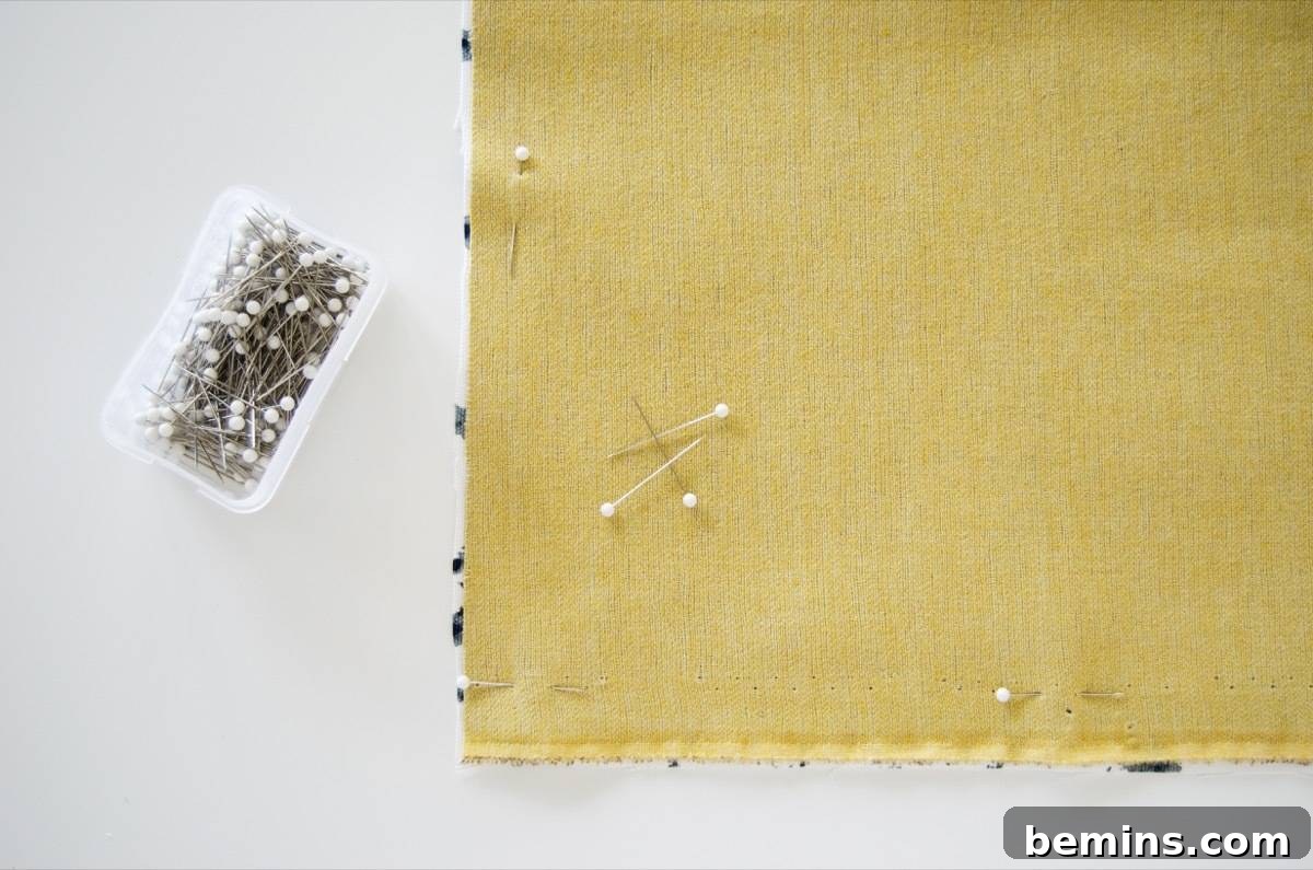 Pinning cotton fabric to vinyl fabric for the picnic blanket