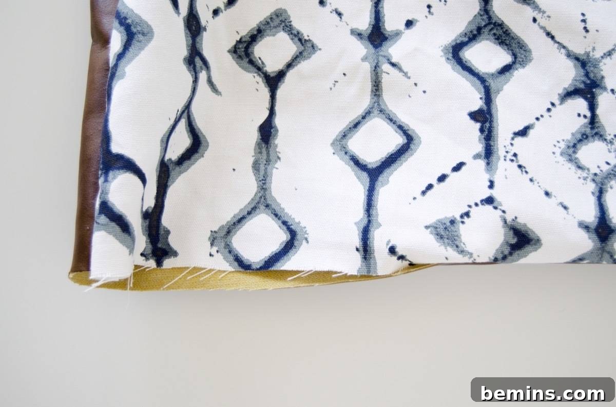 Stitching the backing and front of the picnic blanket together, leaving an opening