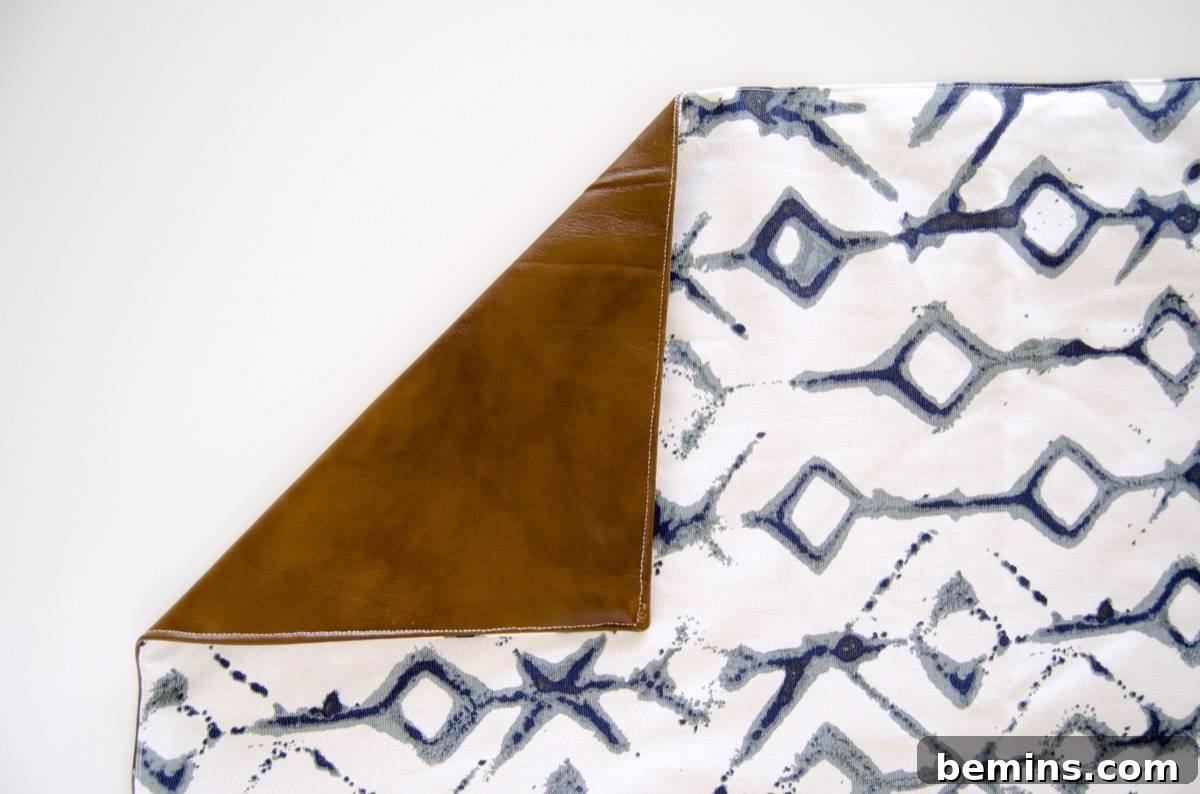 Top stitching along all edges of the waterproof picnic blanket