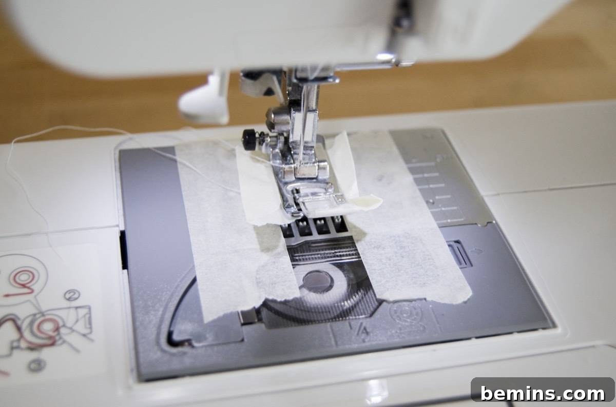 Using masking tape on the sewing machine foot for sewing vinyl