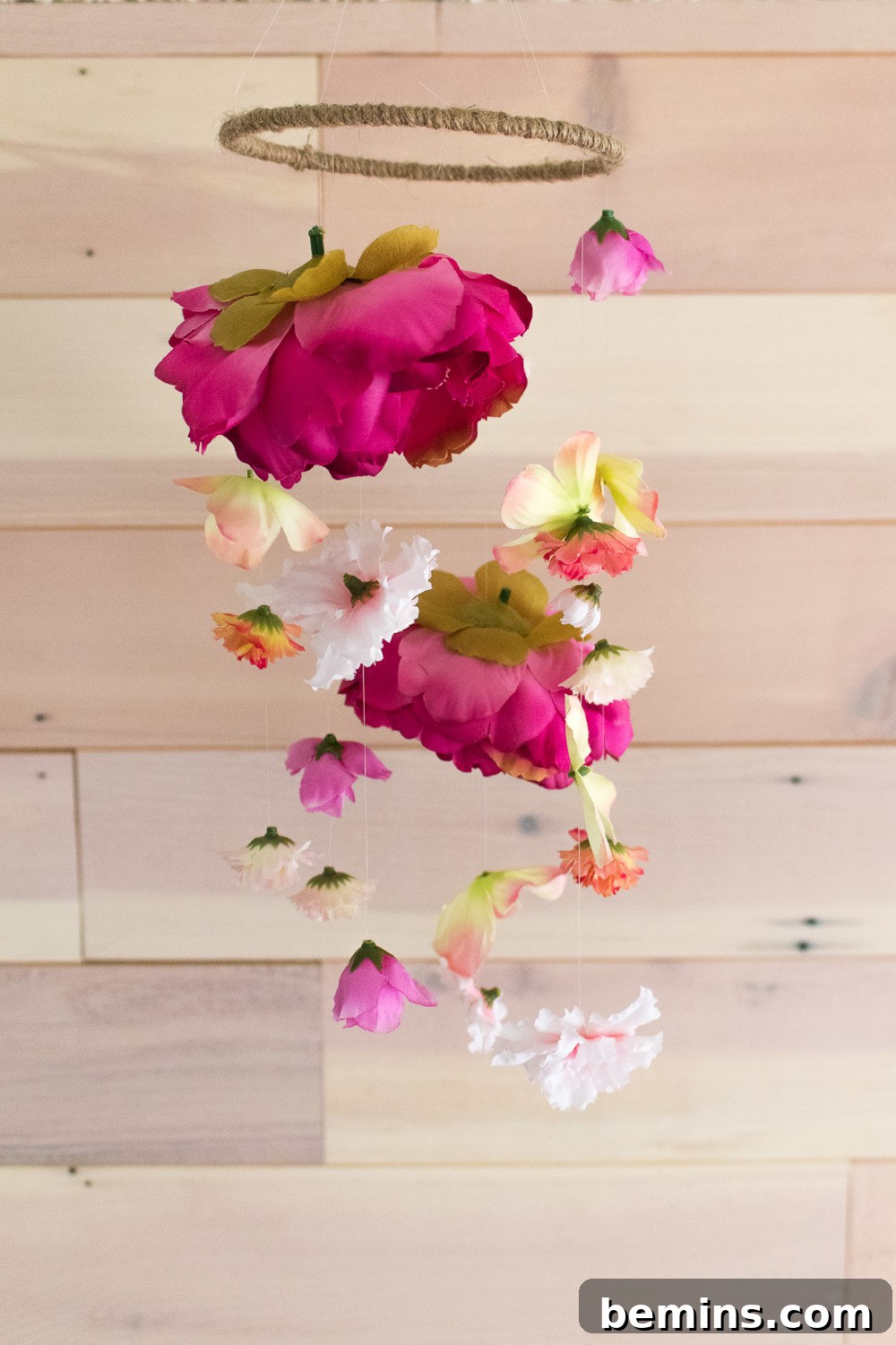 Handmade floral mobile hanging in a room