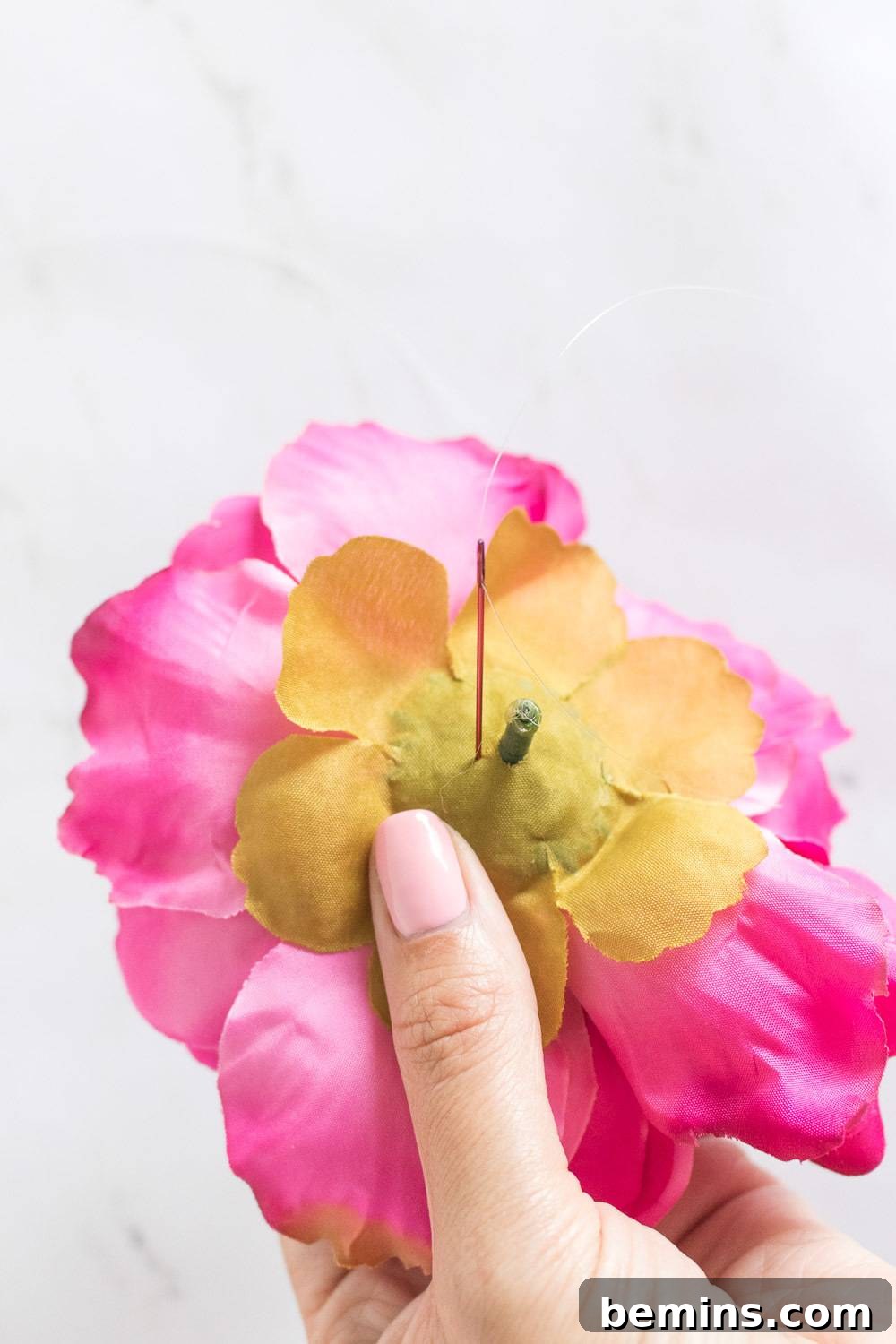 Cutting faux flowers from their stems