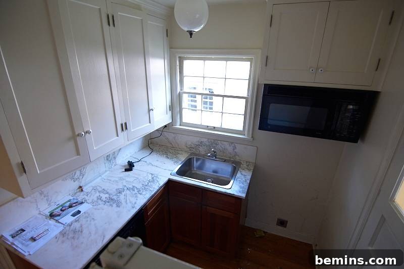Minor Demolition: Curbly Home Renovation Kick-Off 6 A small kitchen with a window above the sink