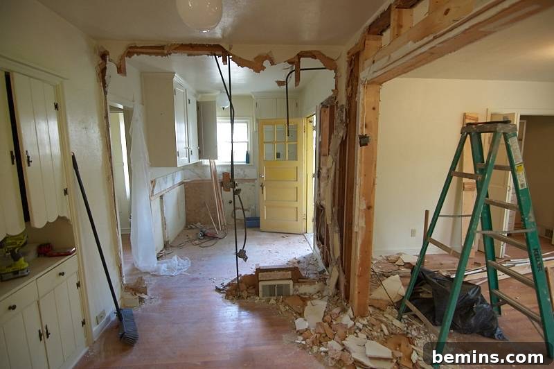 Minor Demolition: Curbly Home Renovation Kick-Off 10 A room under construction with a ladder and broom