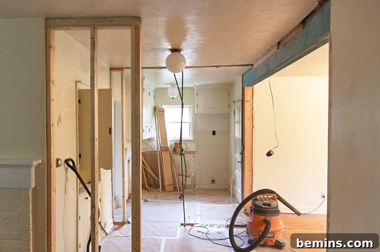 Renovation work in progress inside an apartment, showing the early stages of kitchen remodeling