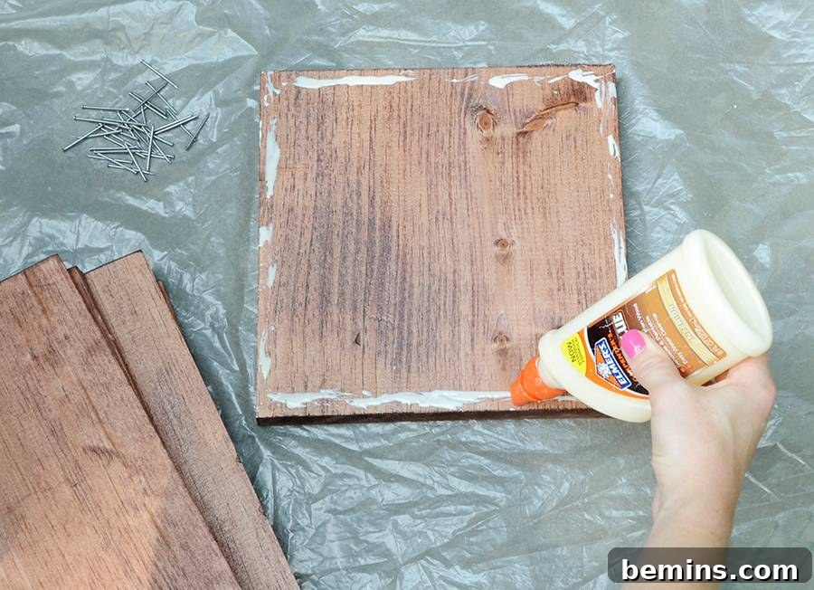 Applying wood glue to the base