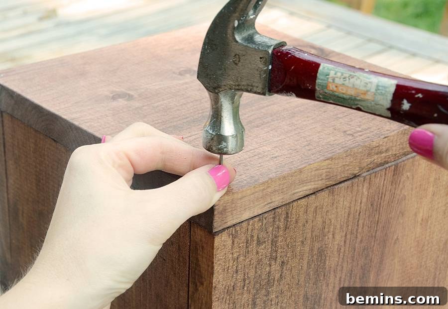 Securing the boxes with nails