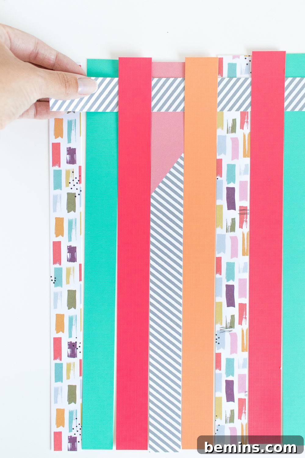 Person is doing a wall art using colorful papers.