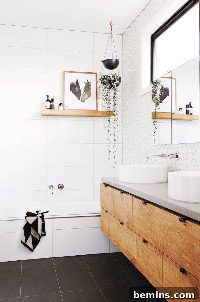 17 Stunning Bathrooms That Embrace the Shower Plant Trend 10 A bathroom with a white wall and a mirror on it.