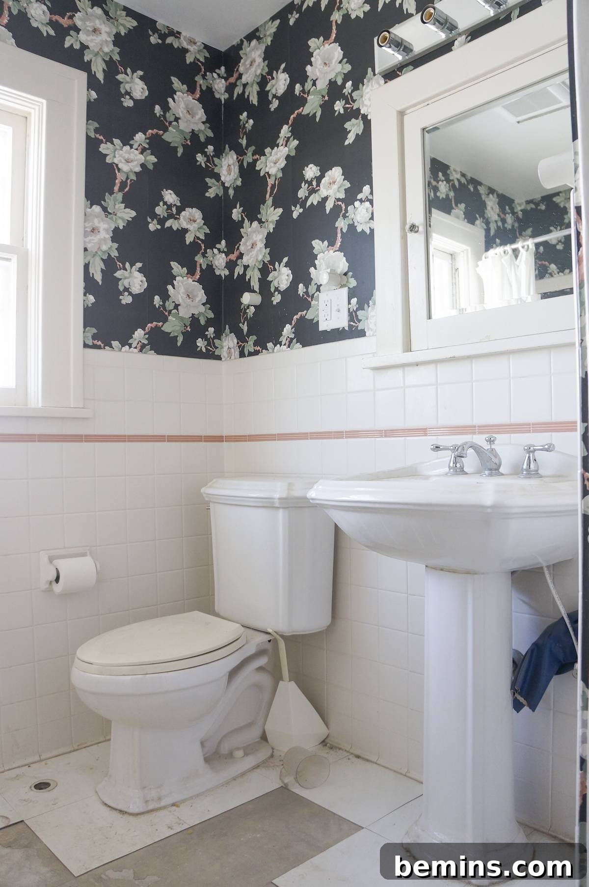 The bathroom's overall style reflecting a 1970s renovation, with no remnants of the original 1917 design.