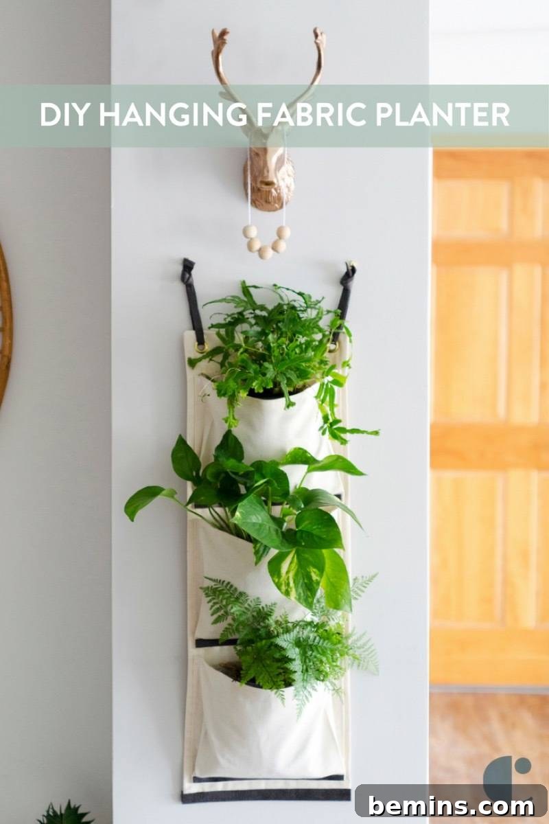 Learn how to make this DIY hanging fabric planter to beautifully display your houseplants!