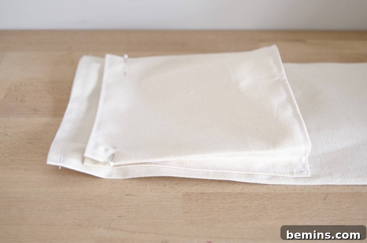 Folding and stitching the bottom of the planter pocket for volume