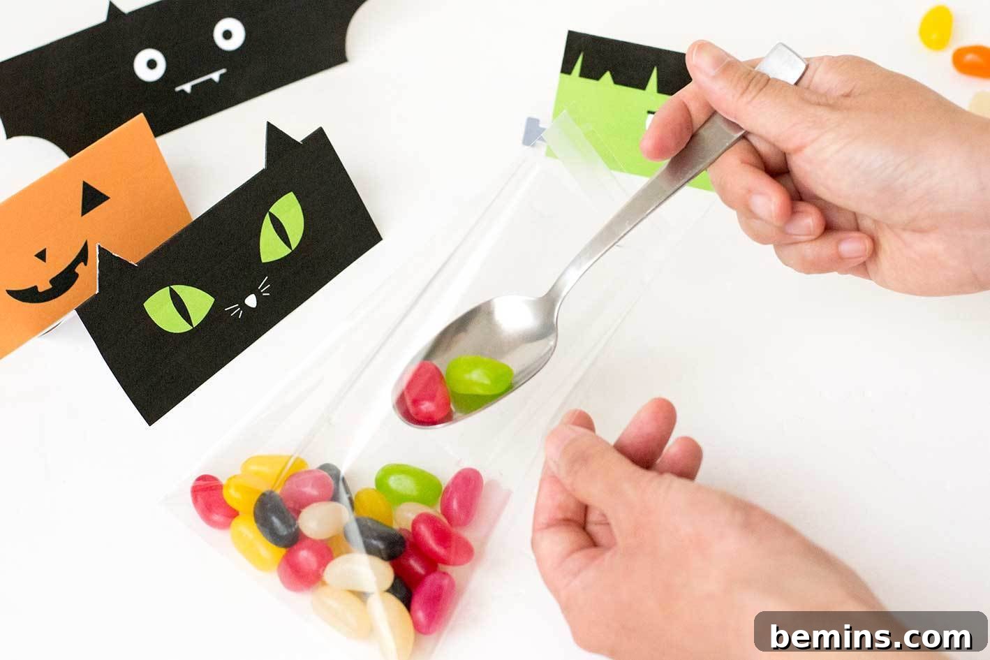 Filling the cellophane treat bags with Halloween candy