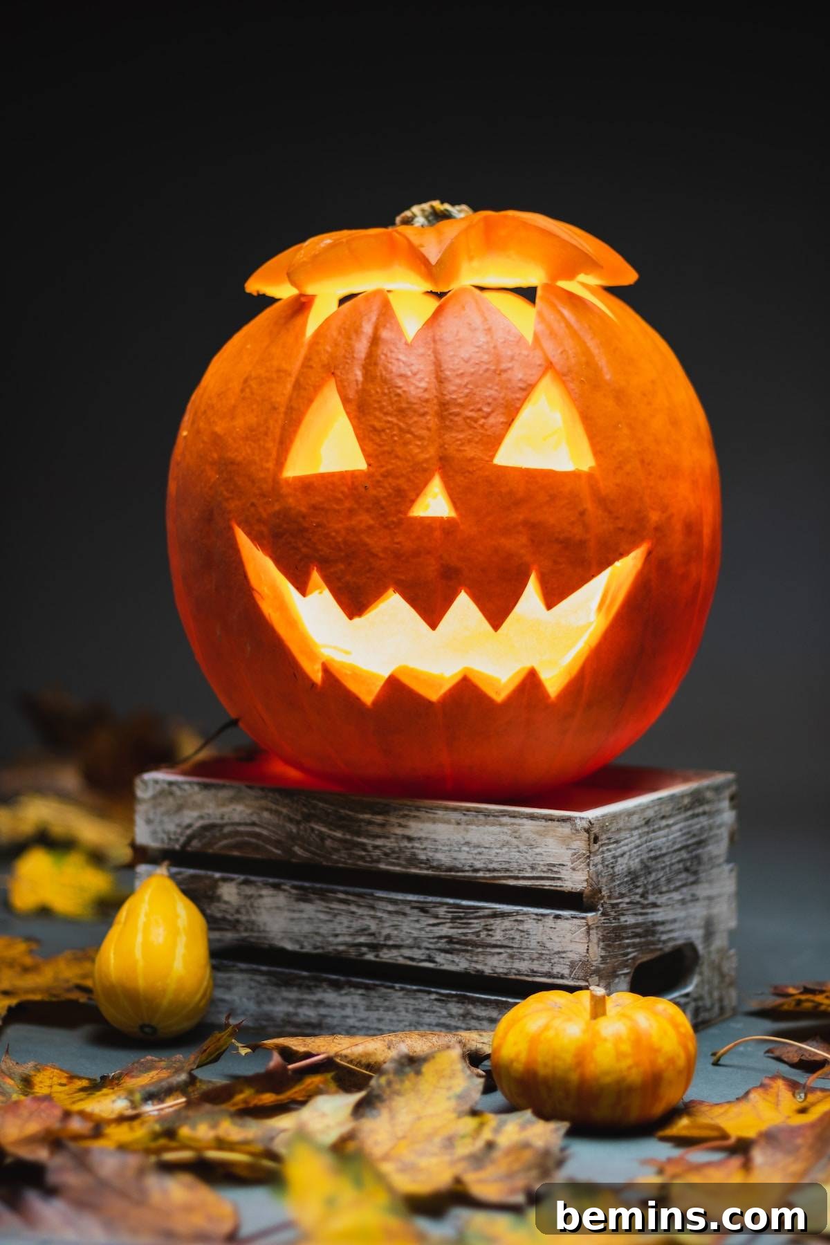The Spooky Soundscape: Crafting the Ultimate Halloween Playlist 2 Lighted jack o'lantern on wooden table with dark background
