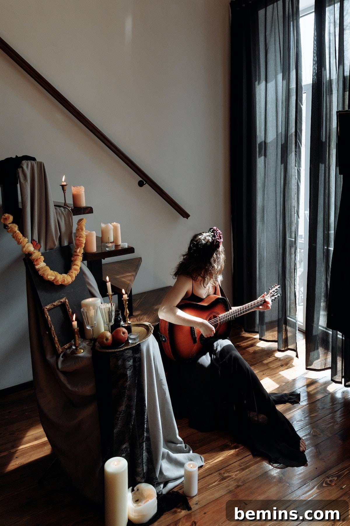 The Spooky Soundscape: Crafting the Ultimate Halloween Playlist 4 A Woman in Halloween Costume Playing Guitar while Sitting on a Wooden Stairs