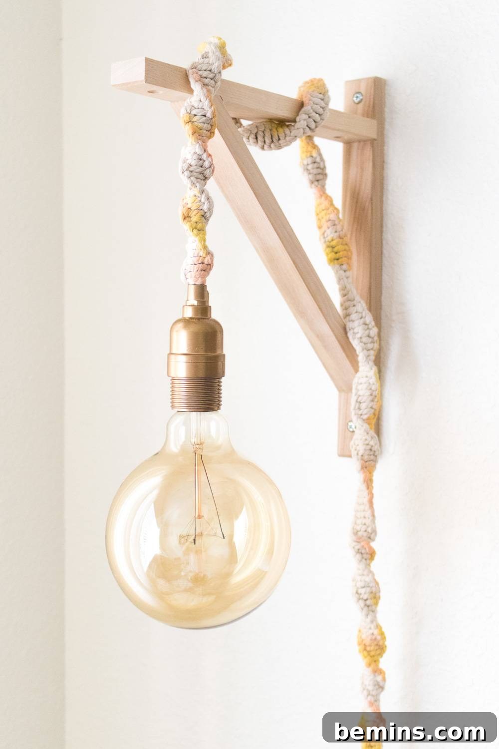 A beautifully designed decorative light fixture featuring a bare Edison bulb, creating a warm and inviting ambiance.