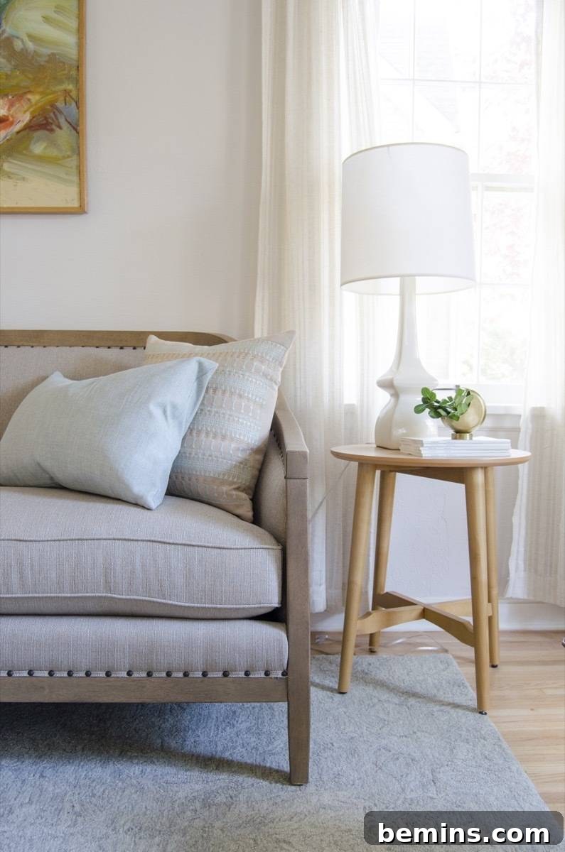 Nailhead Trim Sofa Detail with Side Table and Table Lamp