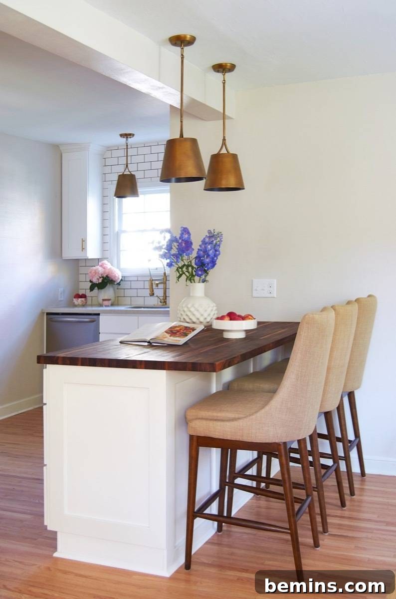 Butcher Block Countertop on Island with White Cabinets