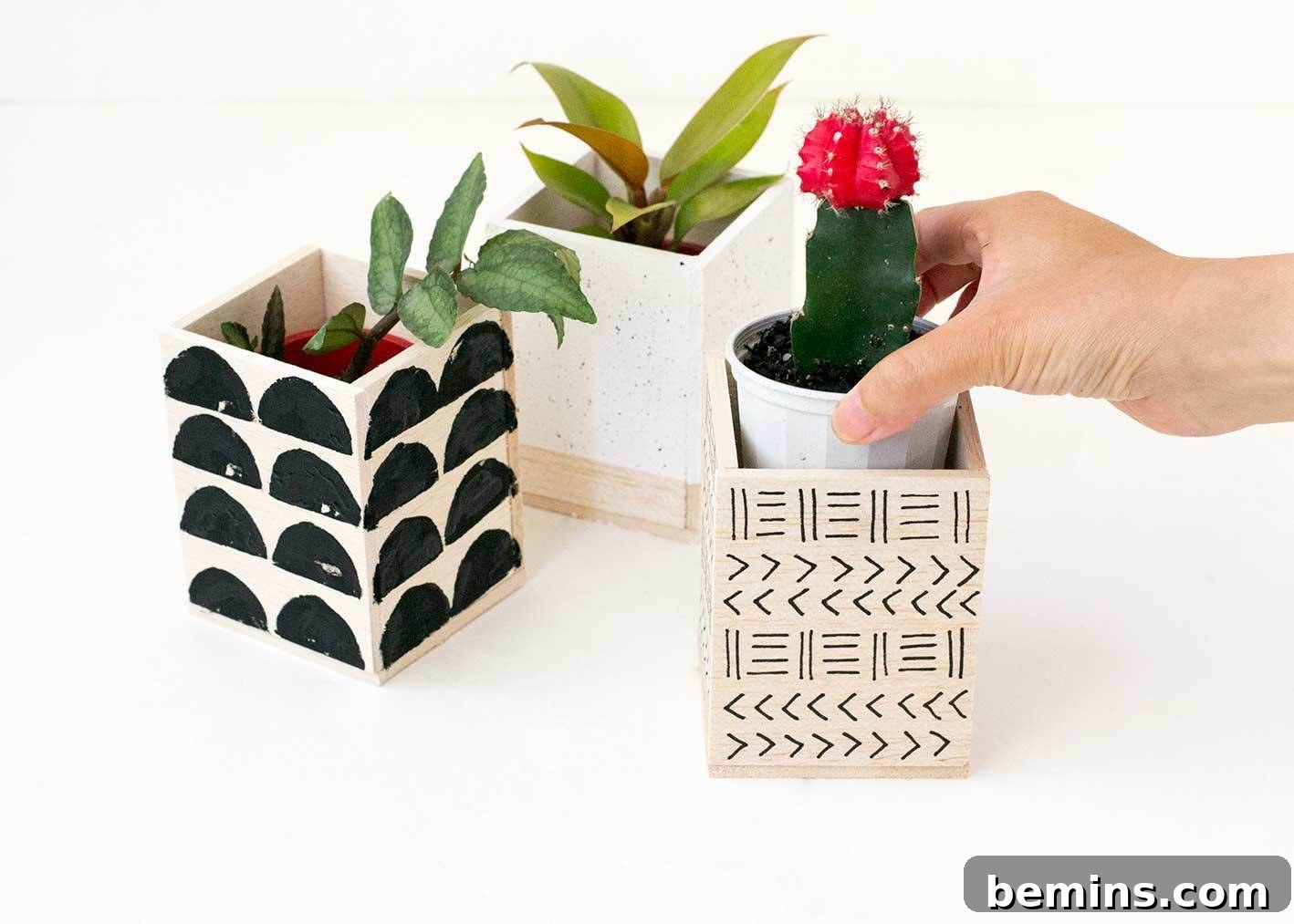 Adding plants to the finished balsa wood planters