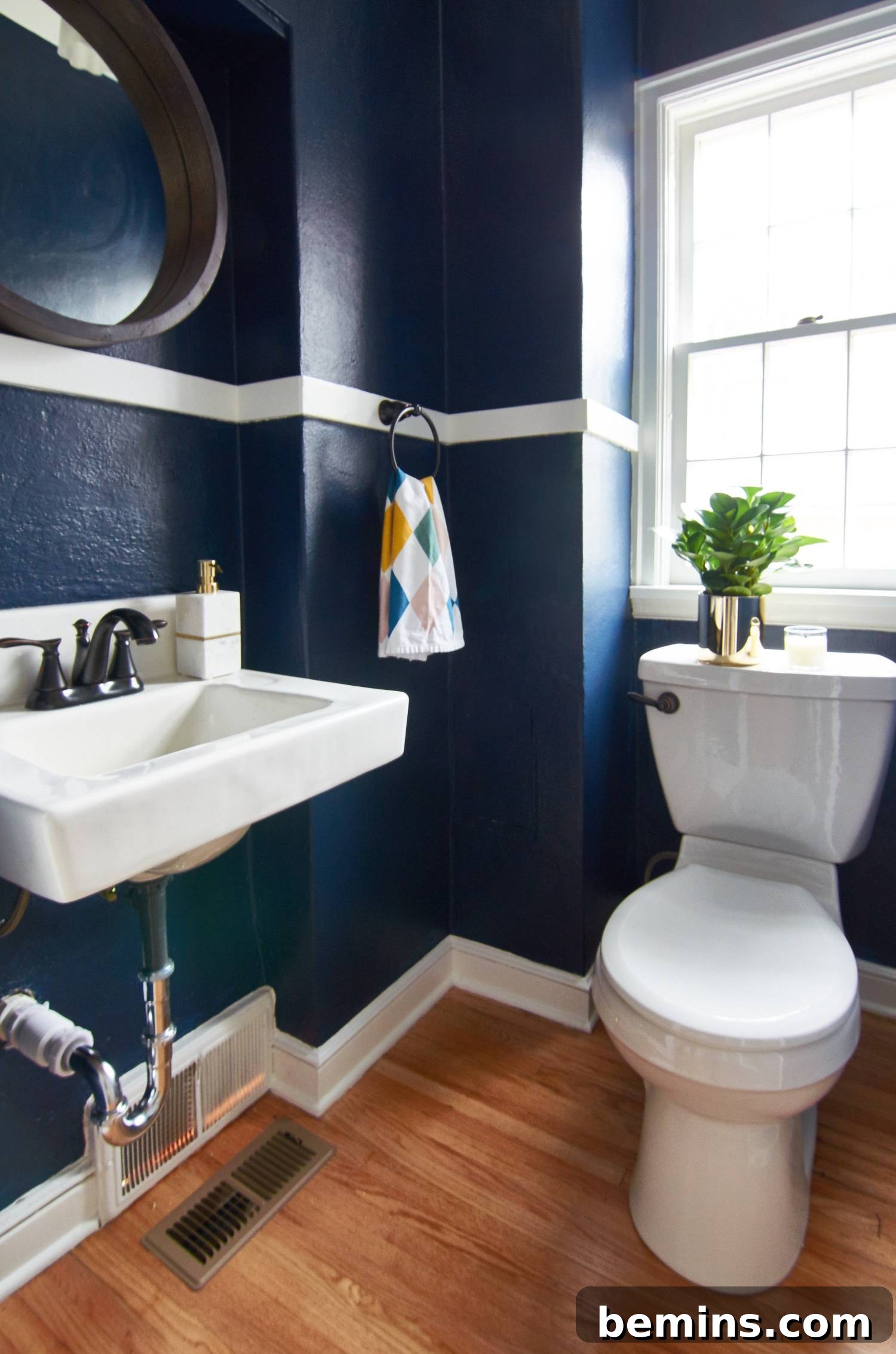 Half bath makeover in a dark color - Sherwin Wiliams Naval 6244