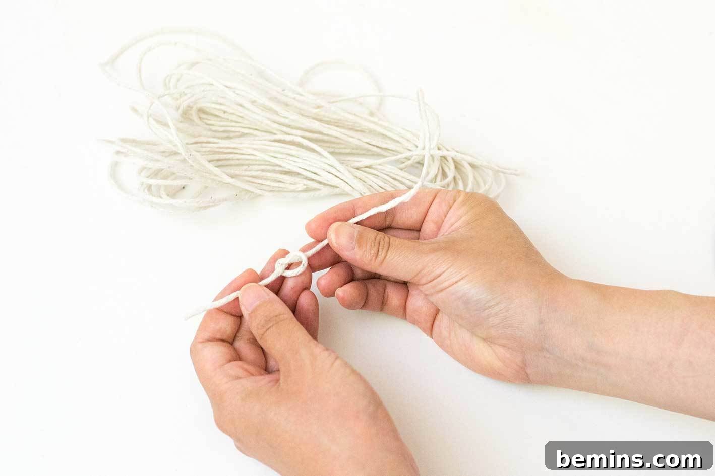 Threading the leaves onto the twine