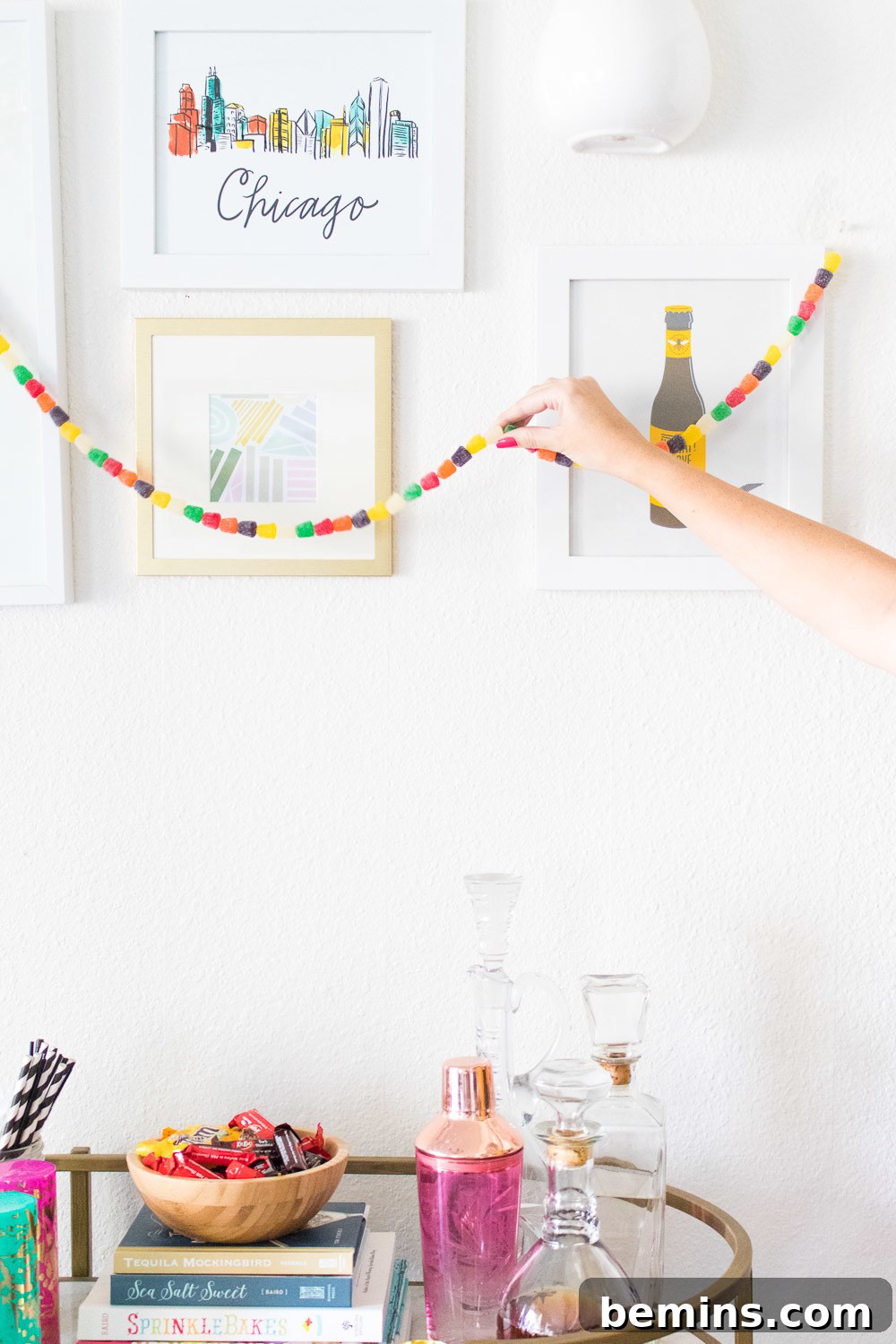 Colorful decorations on a table and the wall of a room.