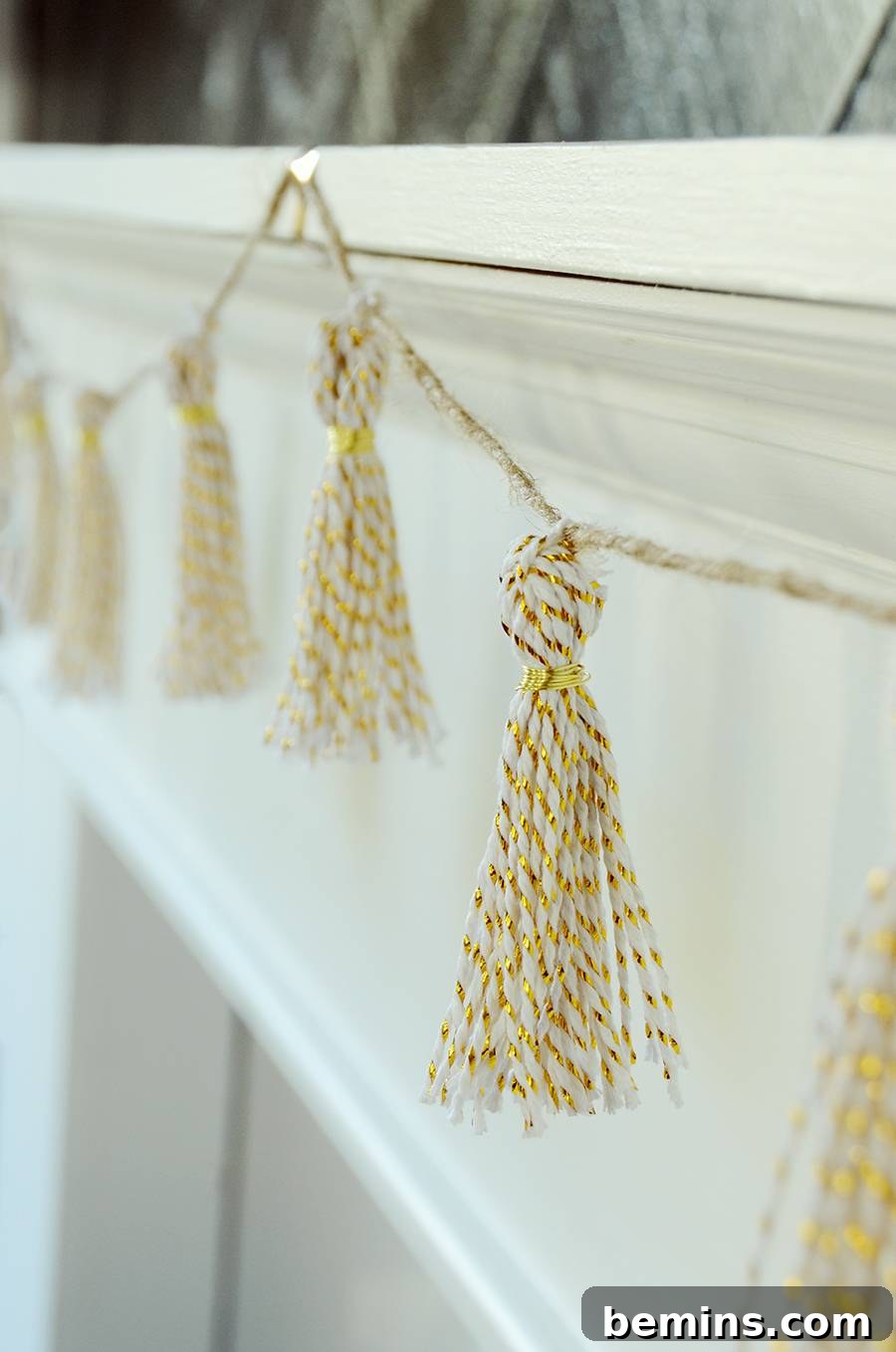 Close-up of DIY Gold Tassel Garland hanging vertically