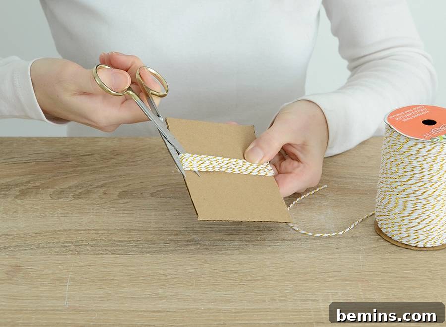 Cutting twine after wrapping around cardboard