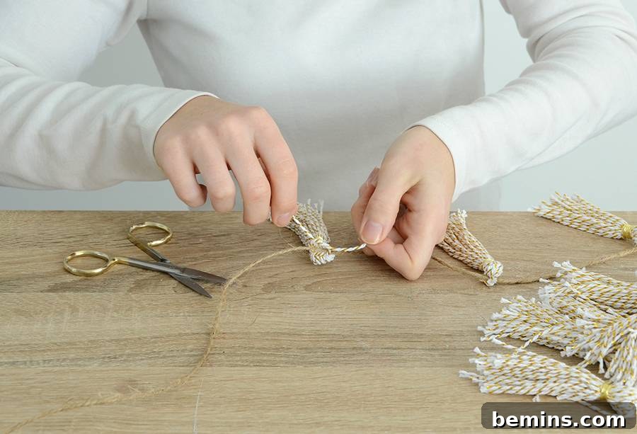 Wrapping gold wire around the top of the tassel