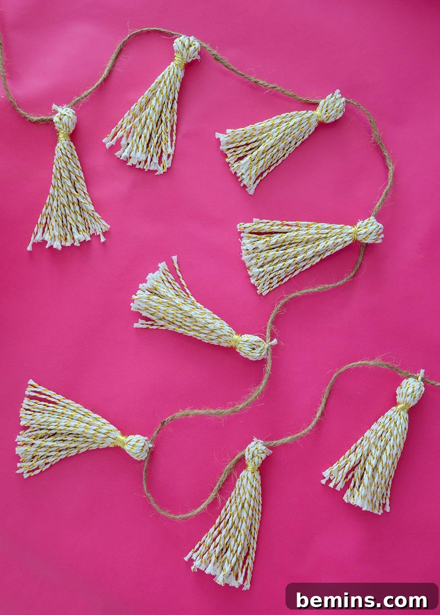 Finished DIY Gold Tassel Garland hanging vertically