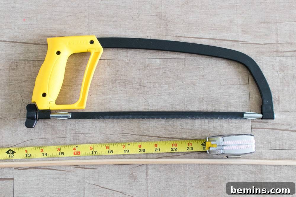 Hand hacksaw blade and measuring tape on the floor.